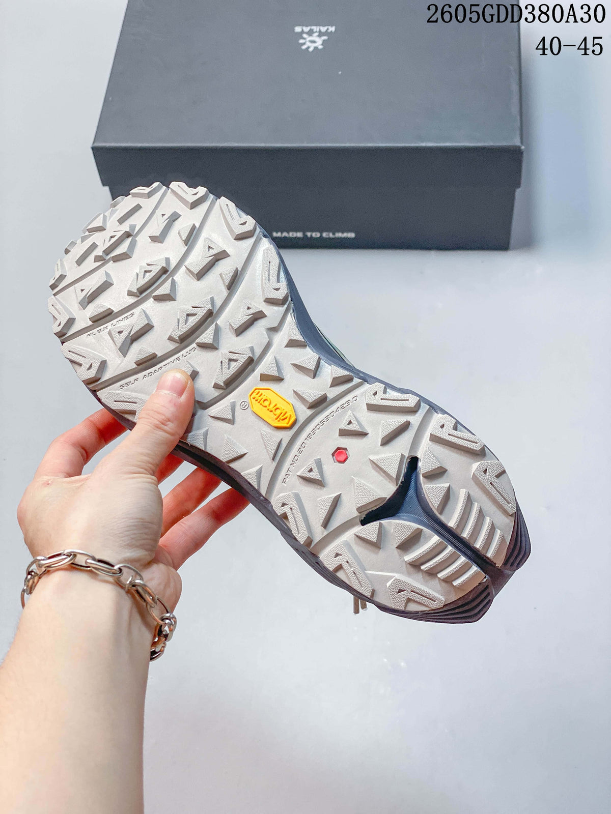 Close-up of the trail shoe outsole with deep lugs and Vibram branding