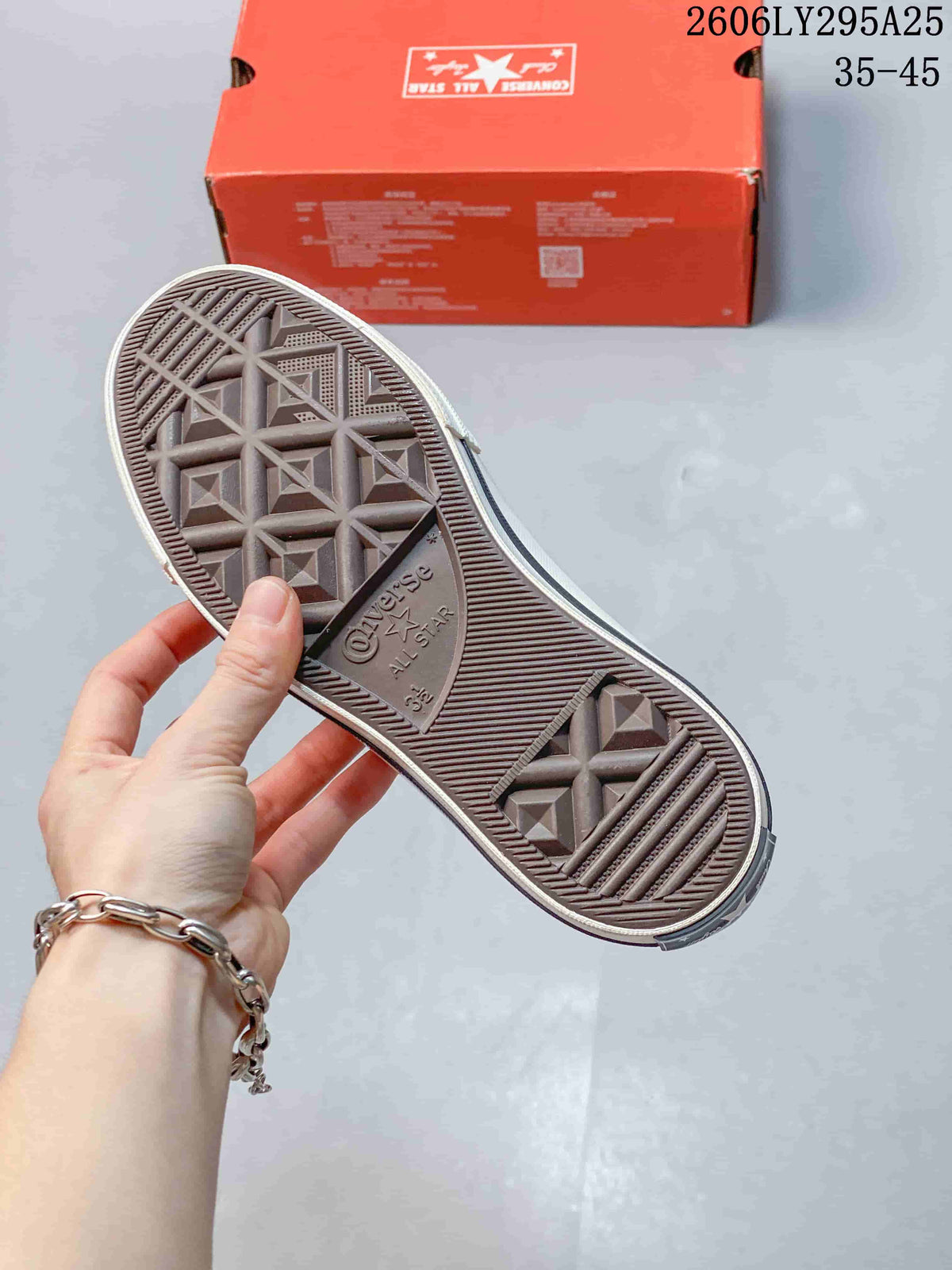 Close-up of the patterned rubber outsole on a Converse sneaker