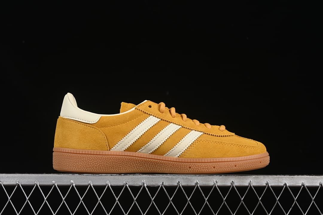 Side profile highlighting the yellow upper, cream stripes and gum-colored sole