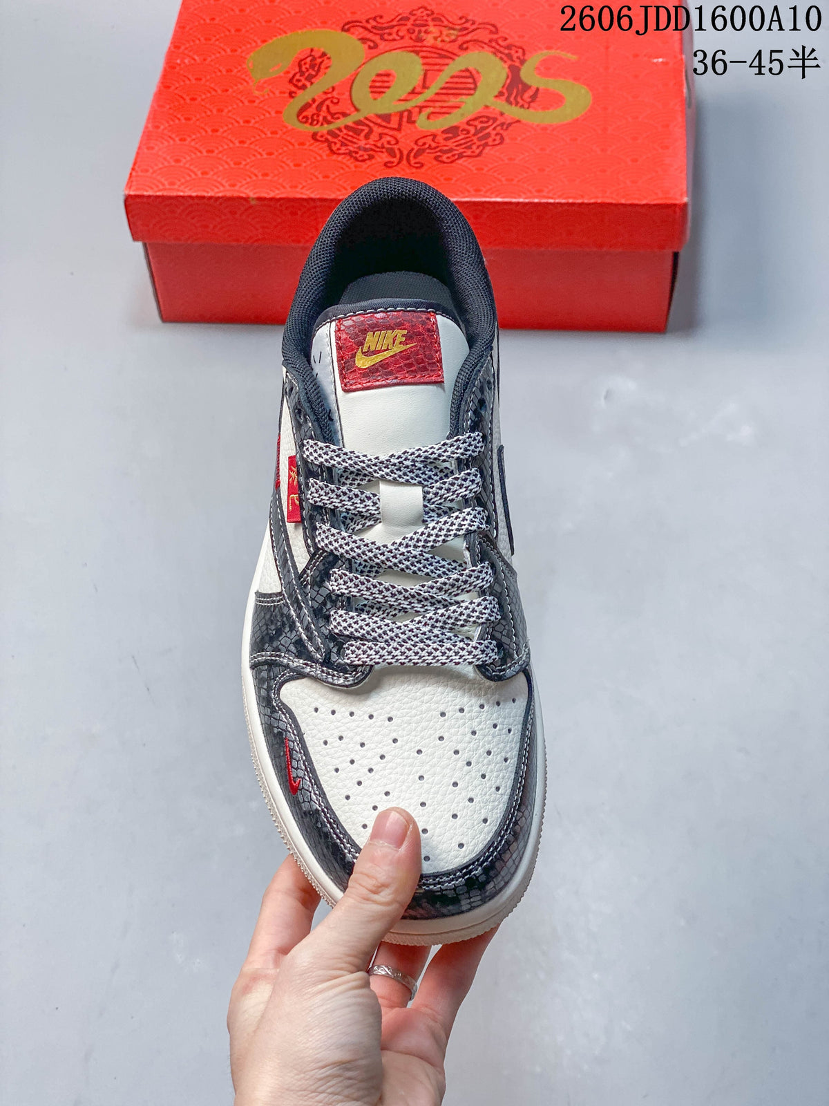 Top view showing perforated toe, contrast laces, and red tongue label