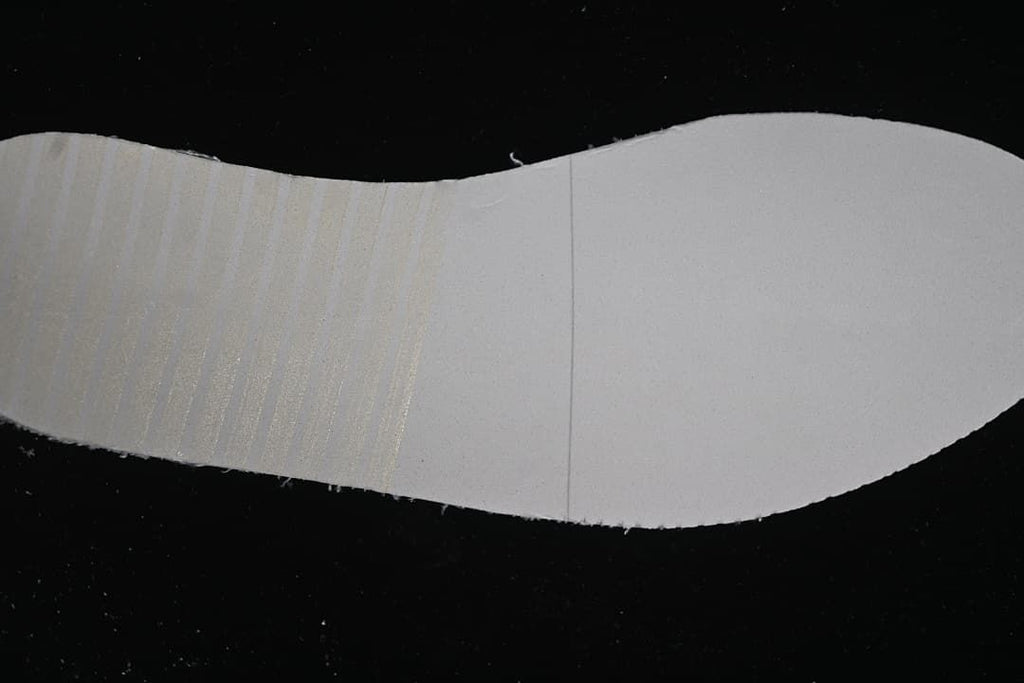 Light-colored shoe outsole shown from below