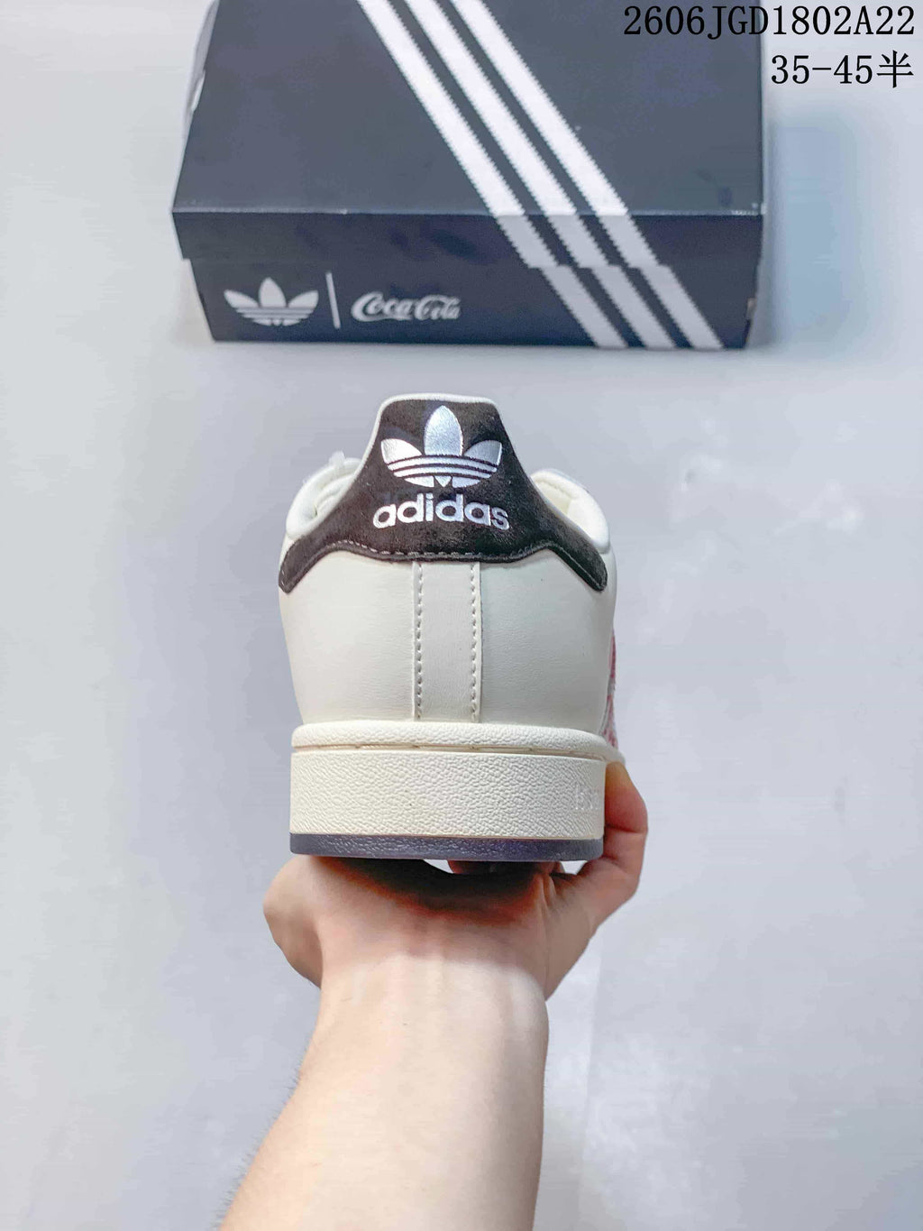 Rear view showing the dark heel detail and Adidas branding.