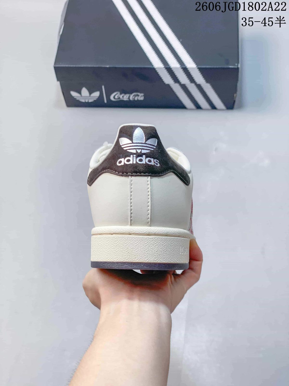 Rear view showing the dark heel detail and Adidas branding.