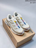 Pair of white and taupe Salomon XT-6 trail running shoes on a branded box.