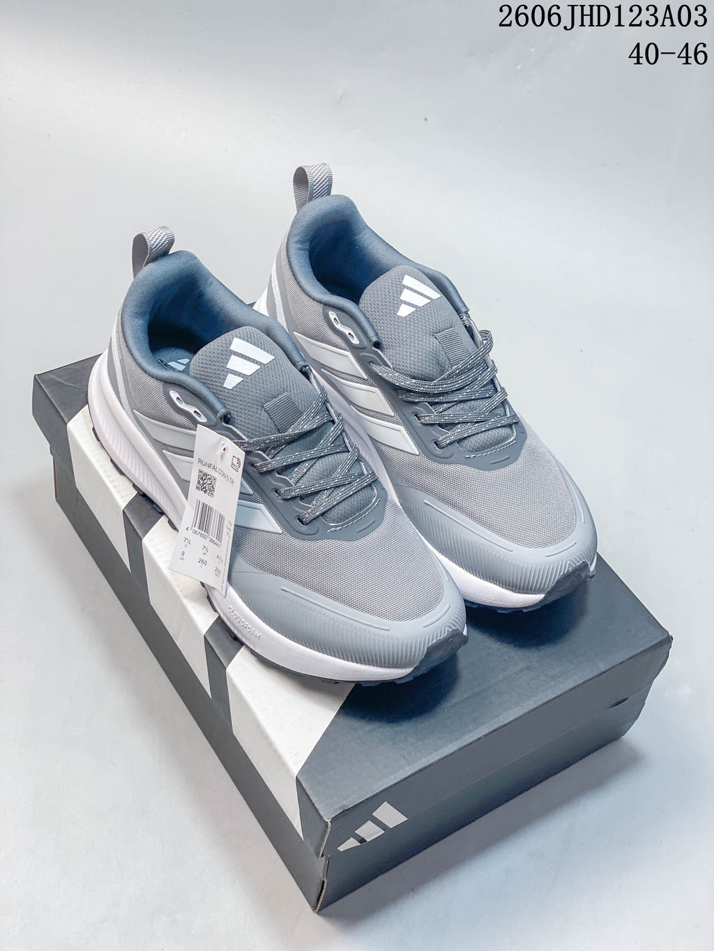 Gray Adidas Runfalcon 5 TR shoes with light side stripes, shown on a shoebox.