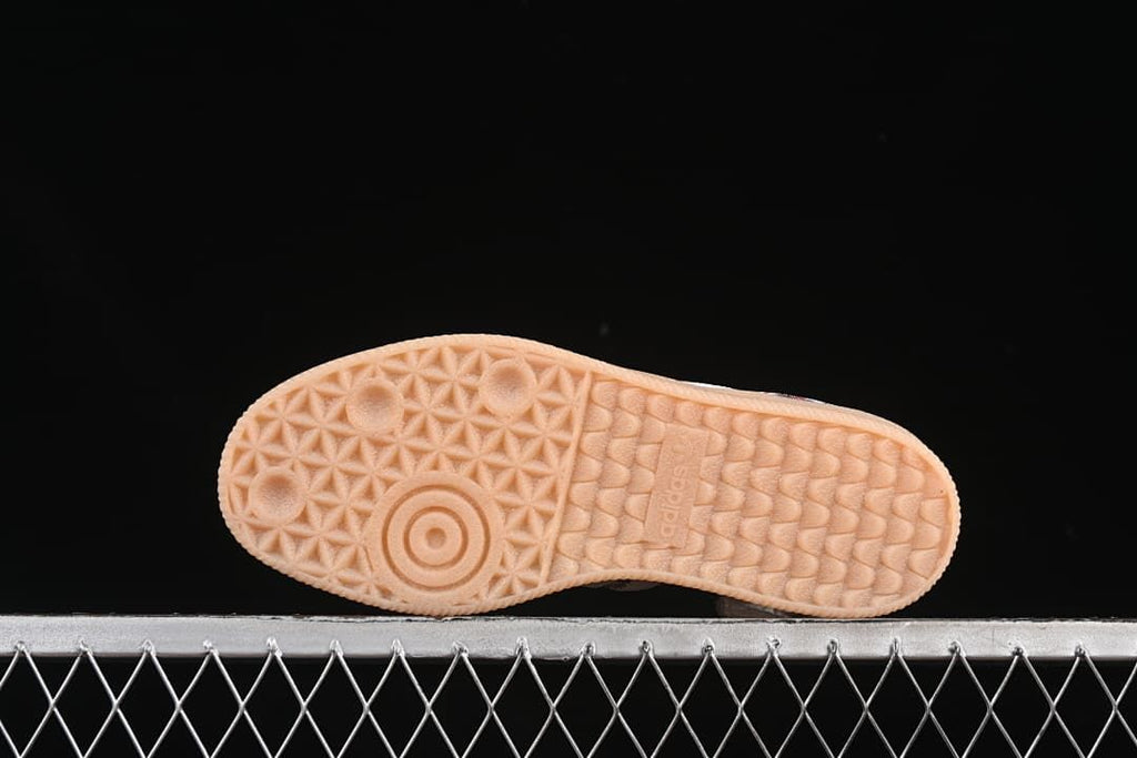 Underside view showing the textured gum-colored outsole.
