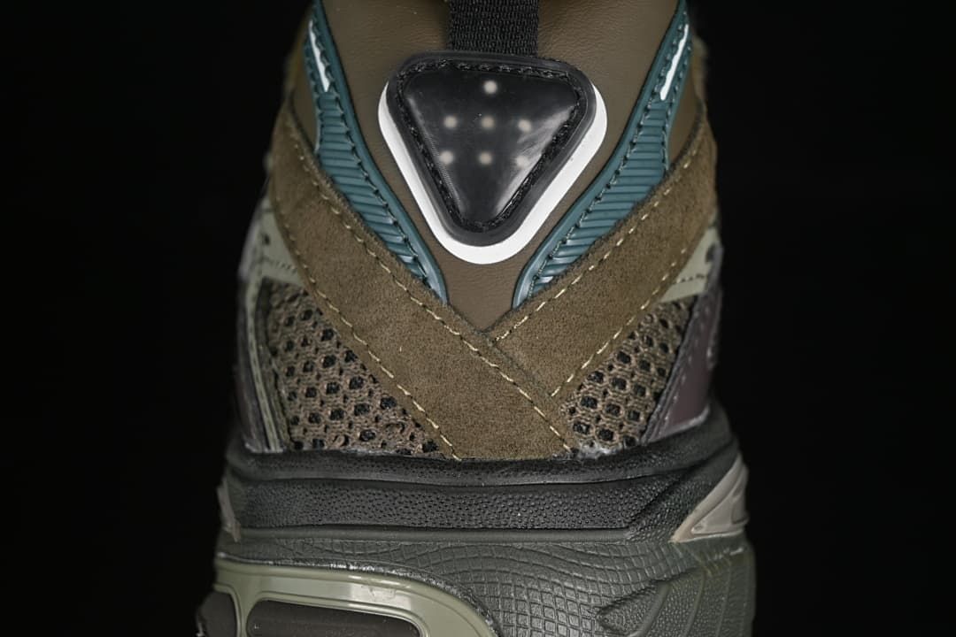 Rear close-up of the sneaker with mesh, layered overlays and a sculpted heel.