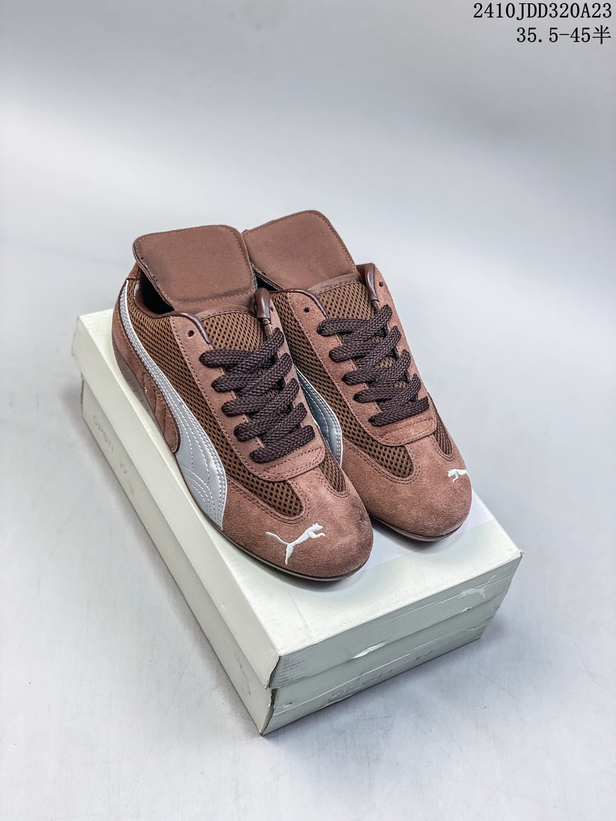 Brown and silver Puma Speedcat sneakers shown from above on a shoe box