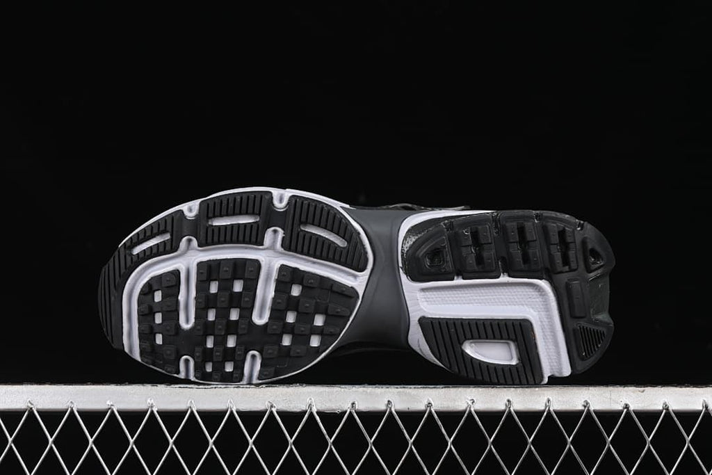 Underside view showing the patterned black-and-white tread
