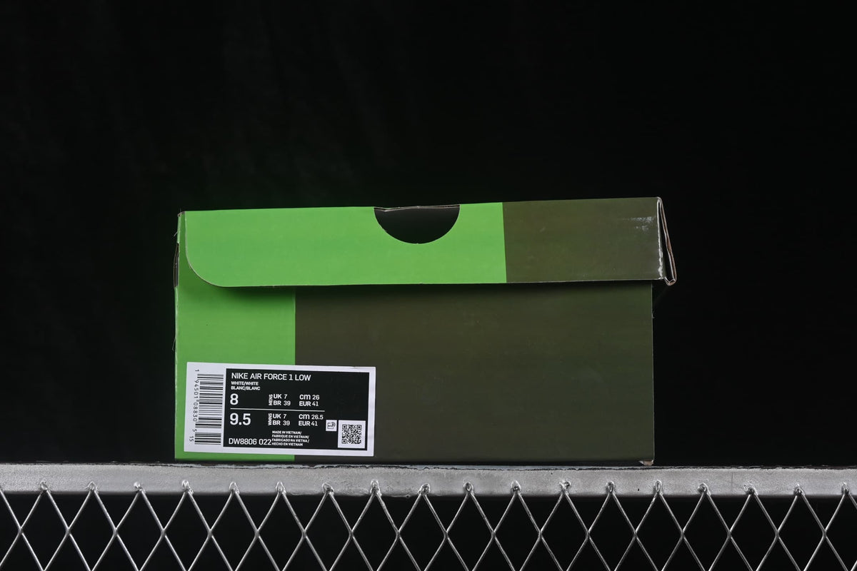 Green sneaker box showing a Nike Air Force 1 Low label with style code DW8806 022 and size details.