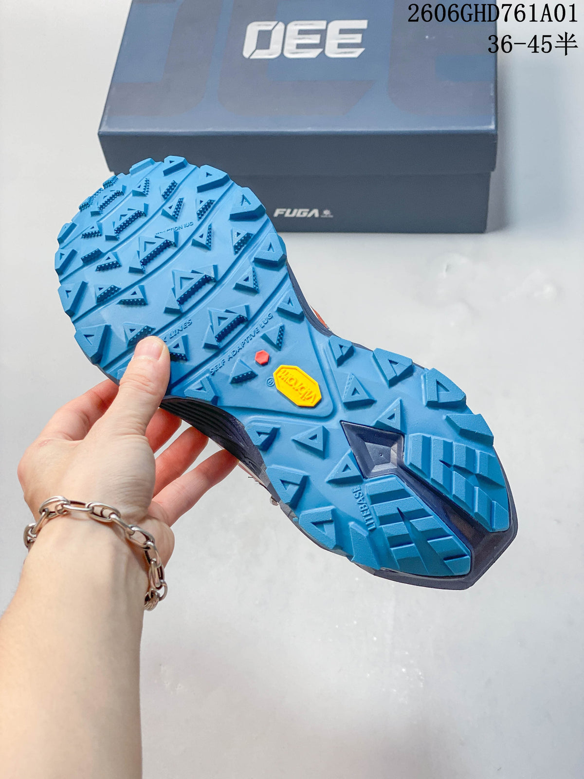 Close-up of the bright blue lugged outsole on a Kailas FUGA EX330 II trail running shoe.