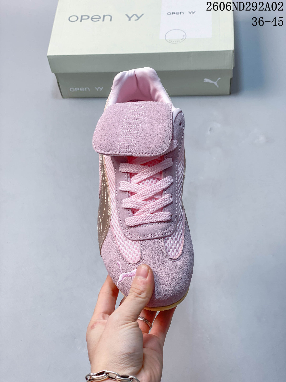 Front view of the sneaker showing its lace-up fastening and fold-over tongue panel.