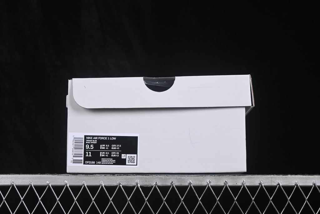 White shoebox with a product label displaying Nike Air Force 1 Low, style code DF0188-148 and size information.
