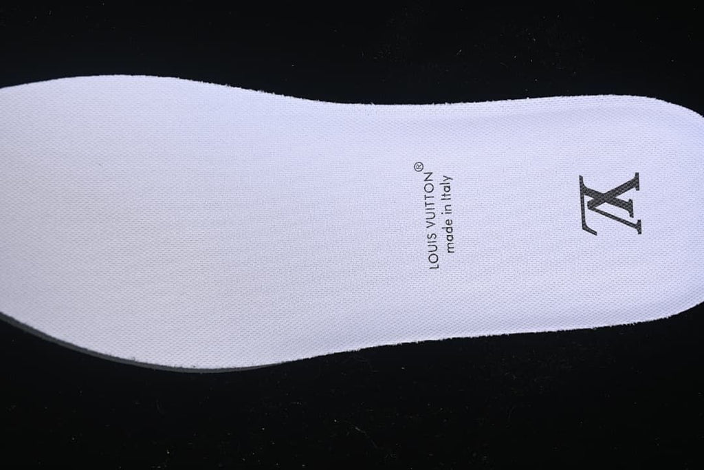 White insole with printed Louis Vuitton text and monogram