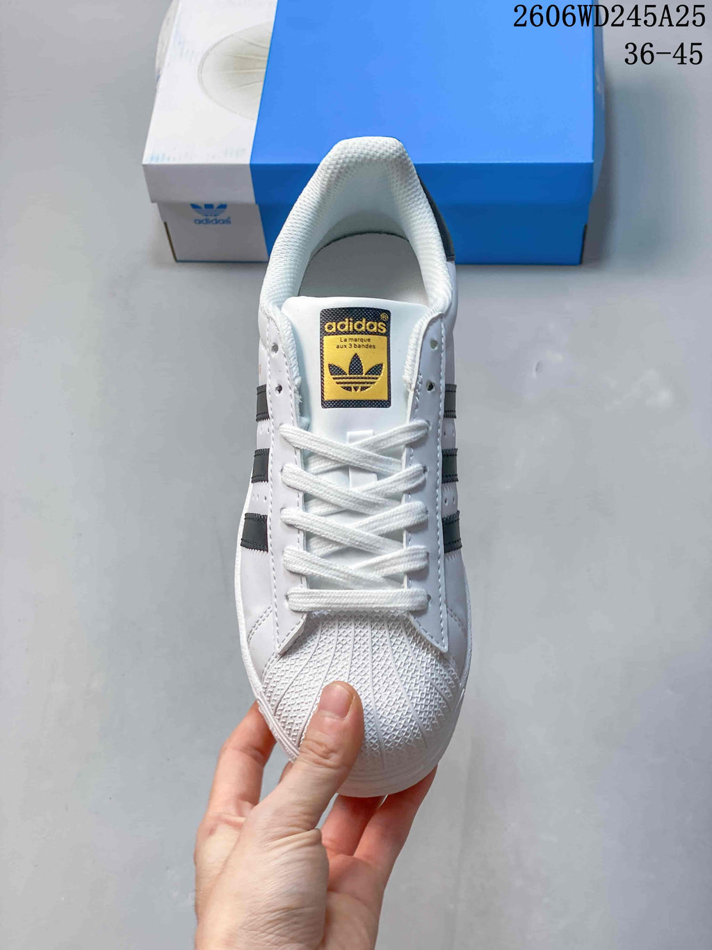Front view showing the shell toe, white laces, and tongue label