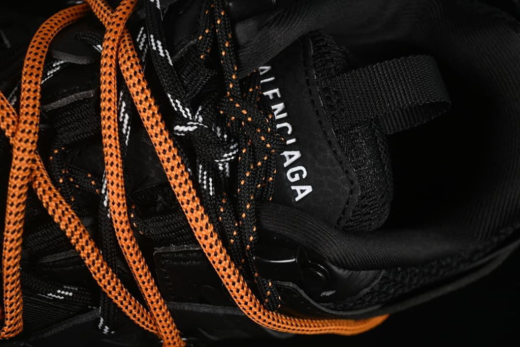 Close-up of the upper, tongue branding, and lace details.