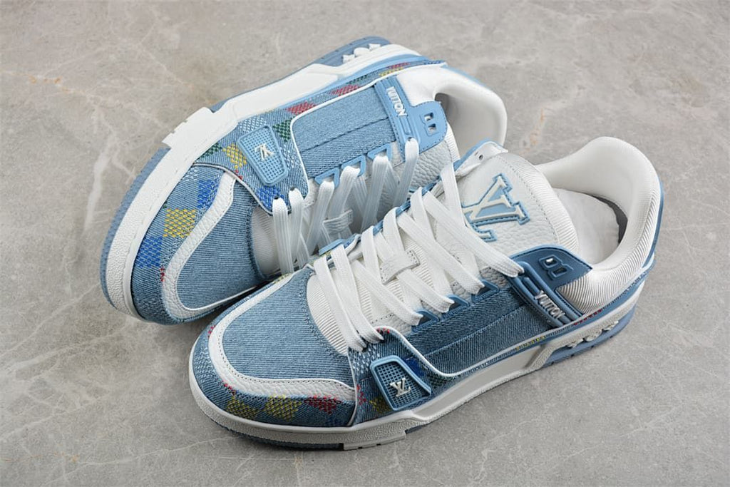 Pair of blue and white low-top sneakers with patterned overlays.