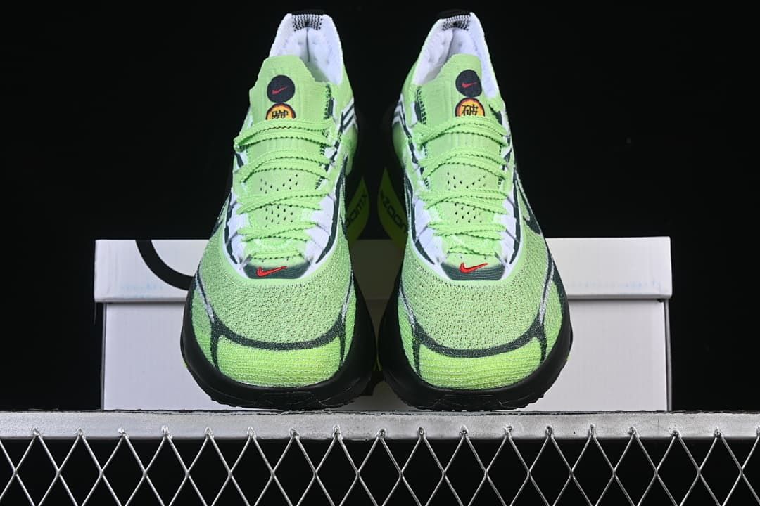 Front view of the pair of bright green shoes
