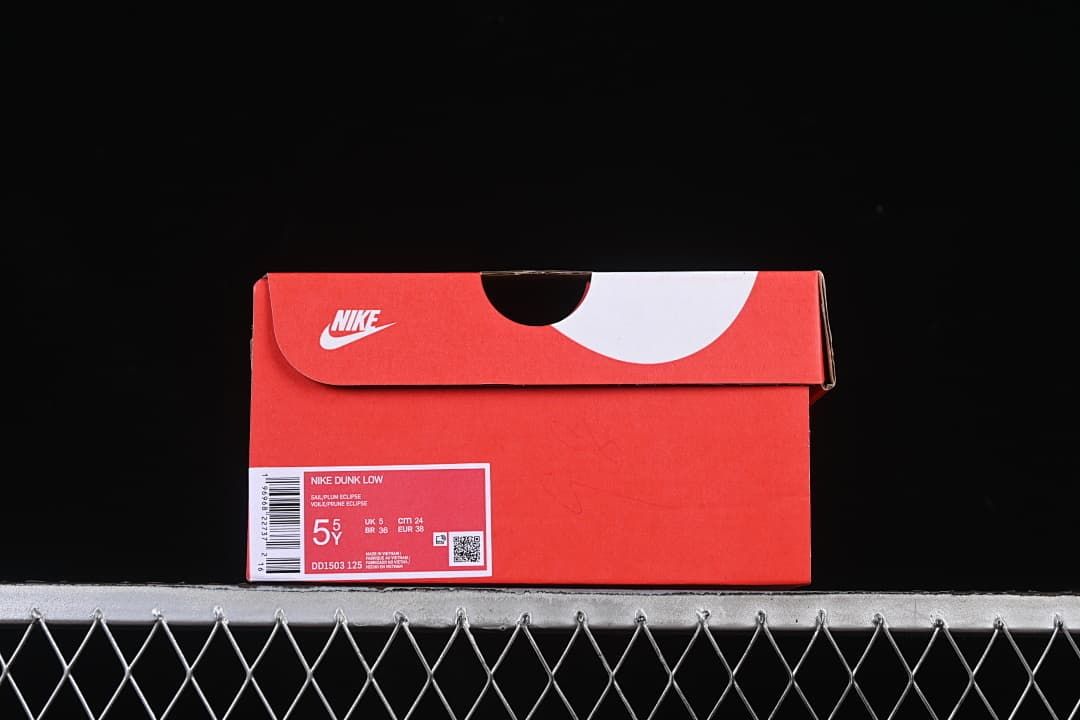 Nike Dunk Low shoe box with a label showing style code DD1503 125 and EU 38.