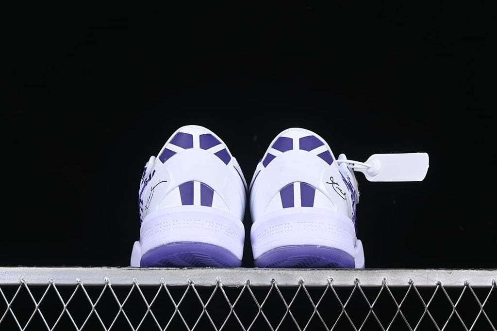 Rear view of both shoes with purple heel details