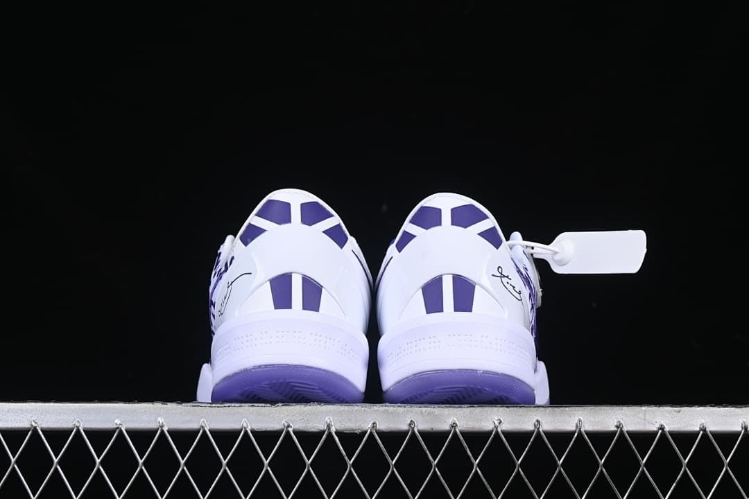 Rear view of both shoes with purple heel details