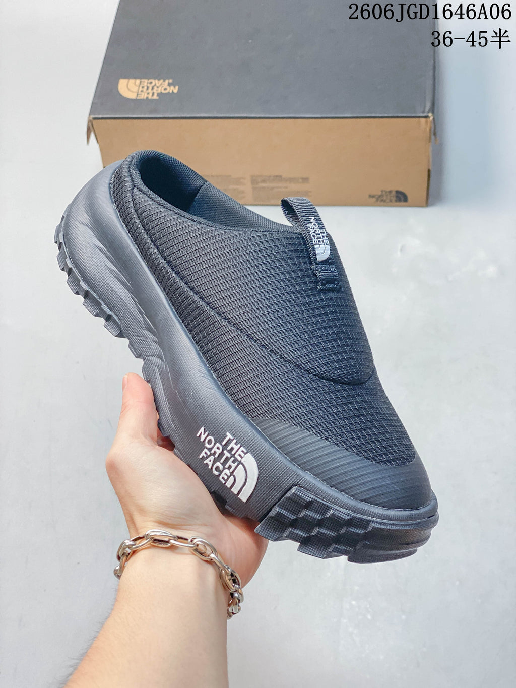Side view of a charcoal The North Face ThermoBall Traction Mule V shoe