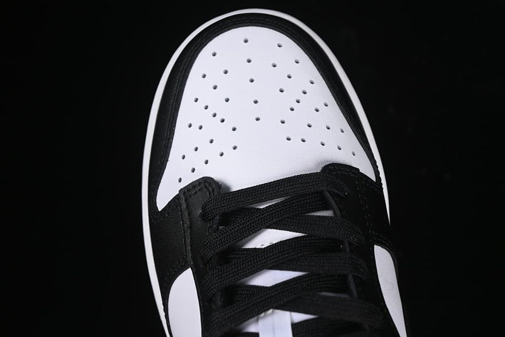 Top view of perforated white toe and black laces
