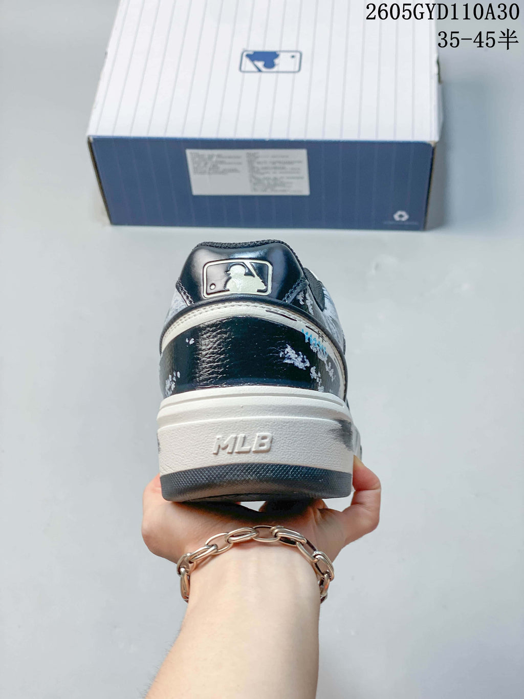 Rear view of the sneaker showing the heel and MLB details