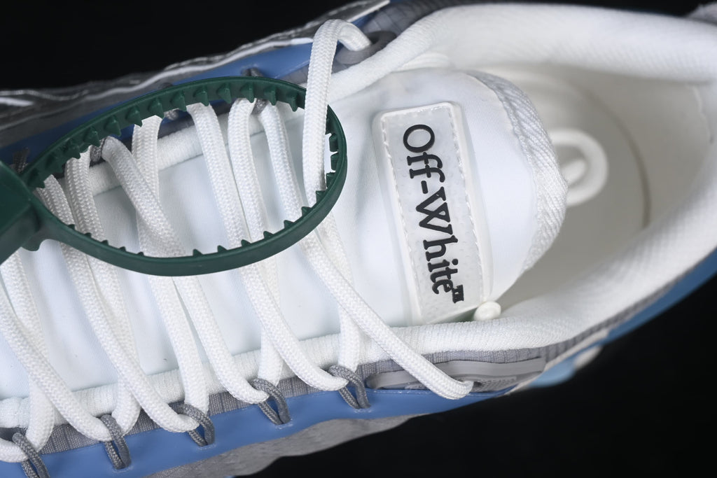 Close-up of the tongue branding, white laces, and green tag