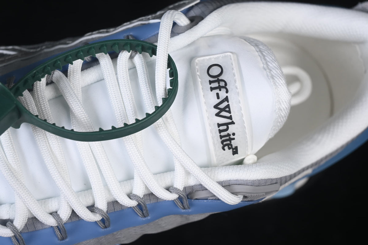 Close-up of the tongue branding, white laces, and green tag