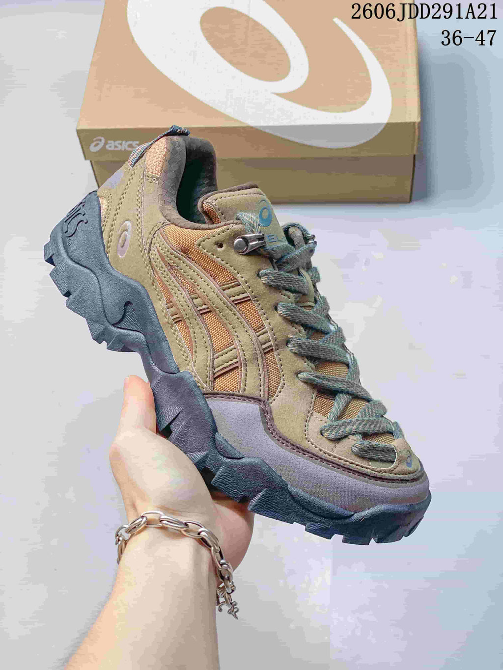 Tan and brown ASICS GEL-PICKAX sneaker with layered side details.
