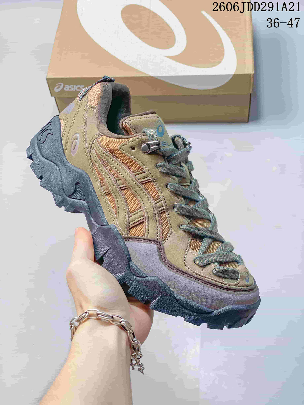 Tan and brown ASICS GEL-PICKAX sneaker with layered side details.