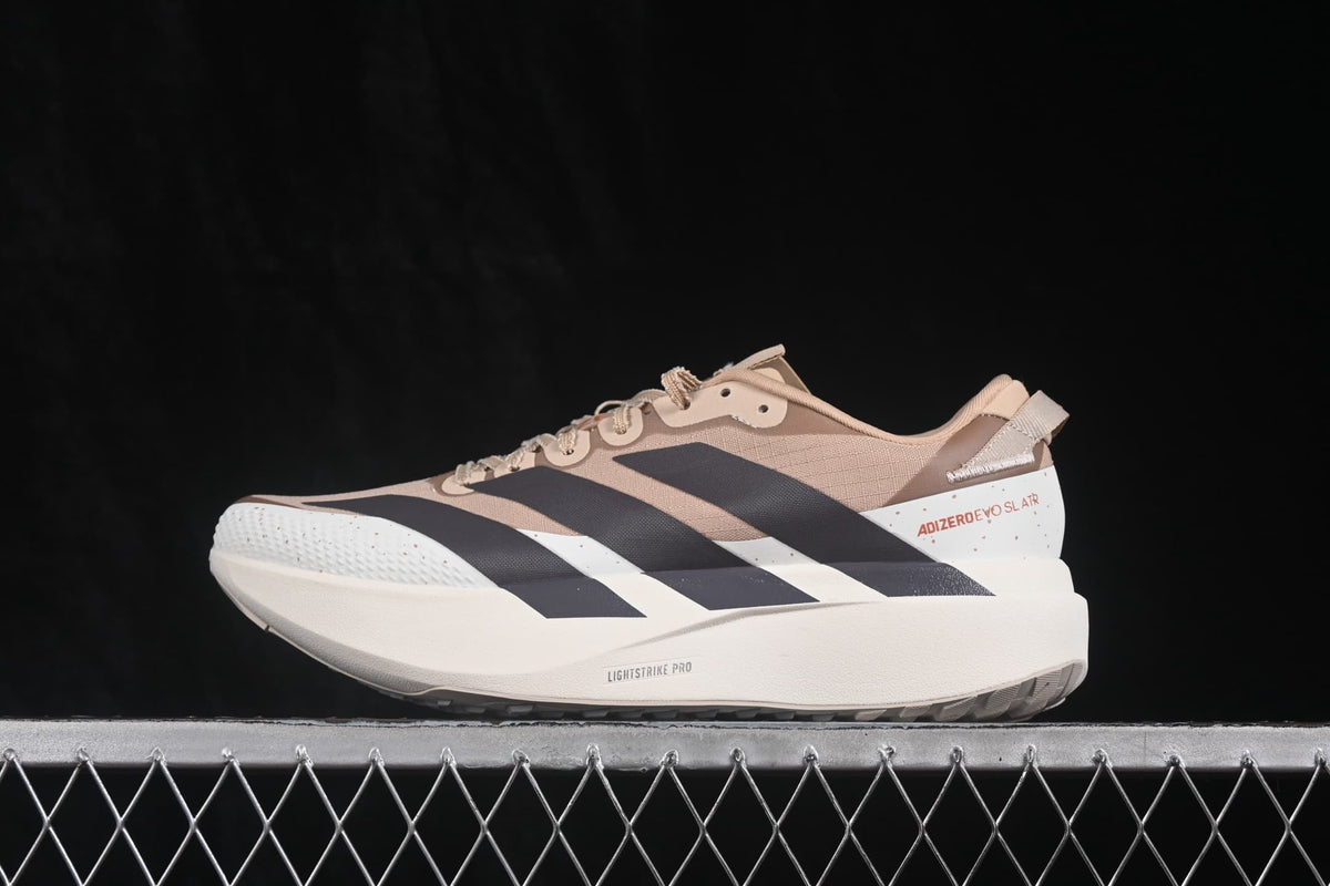 Side profile showing the layered upper, black Adidas stripes, cream midsole and Adizero Evo SL heel marking.