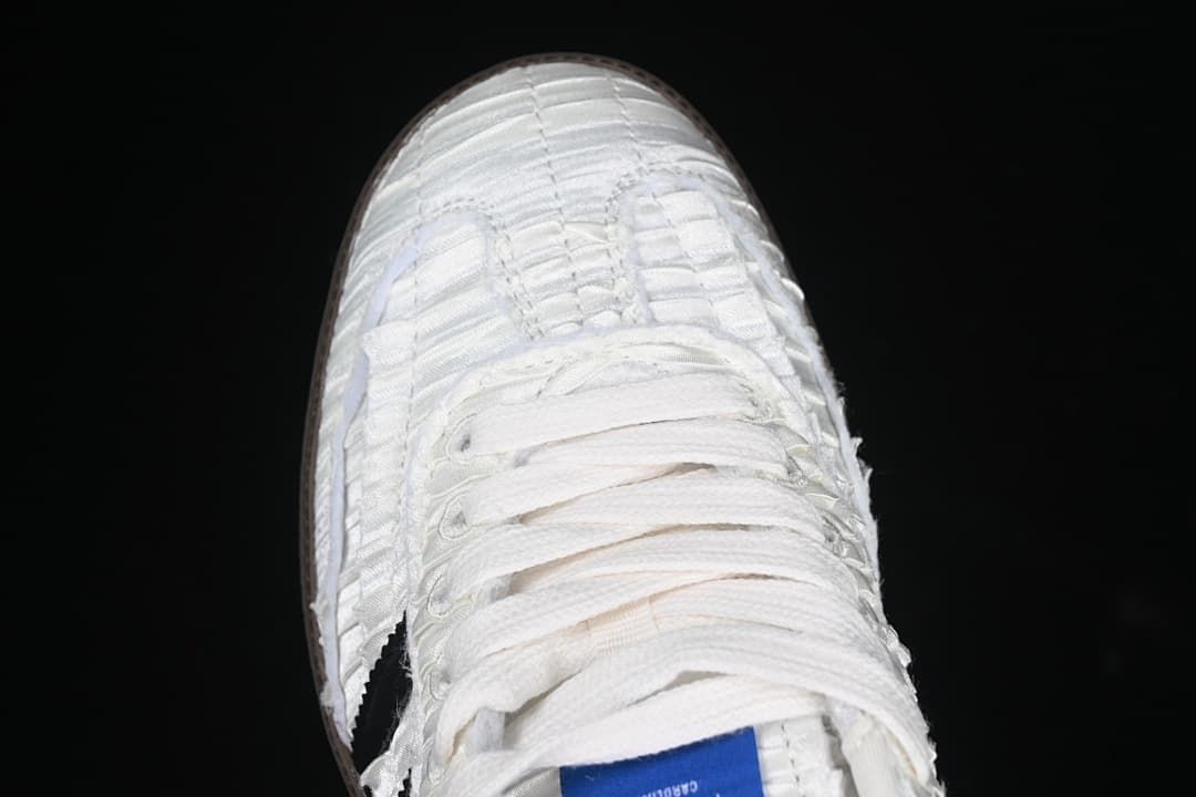 Top-down view of the white laces and textured toe area