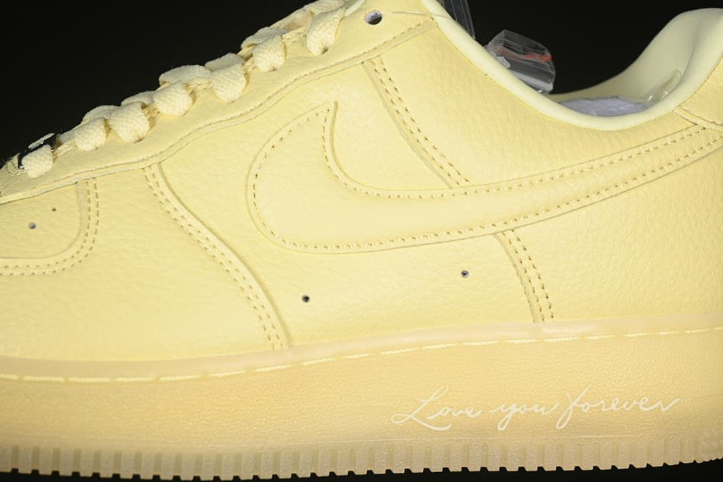 Side close-up showing the tonal Swoosh and midsole lettering