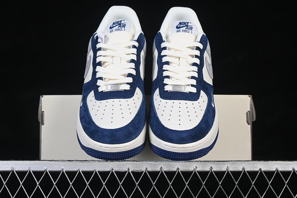 Front view of the pair showing perforated toe boxes and navy overlays.