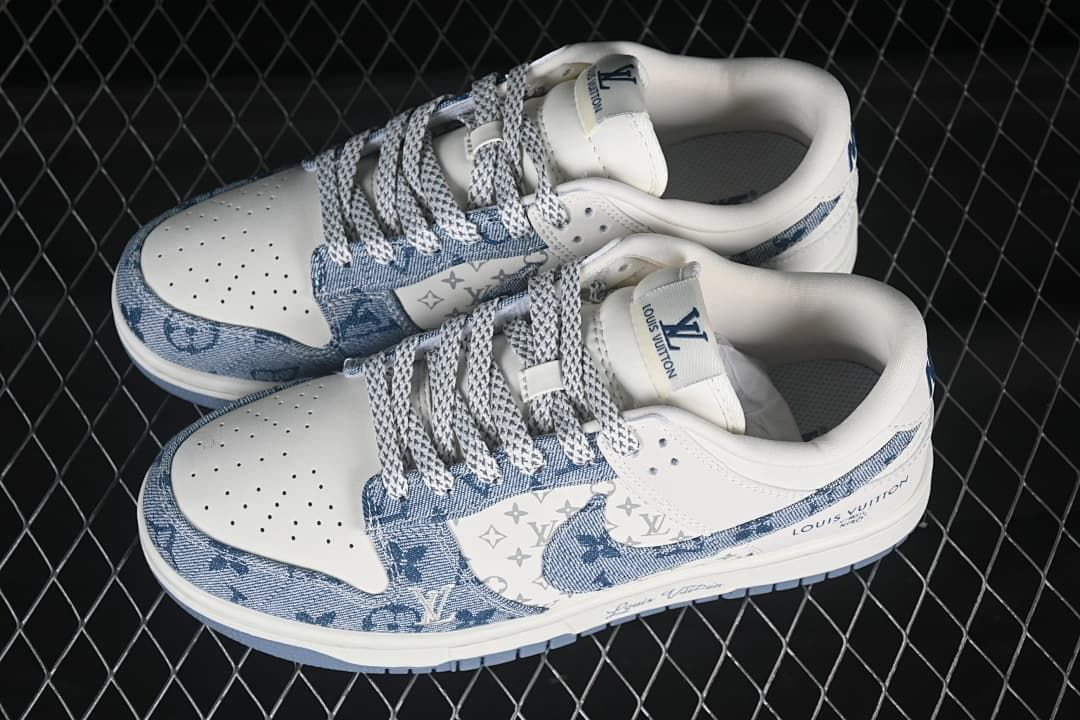 Pair of white and blue low-top sneakers with patterned denim-style panels, viewed from above