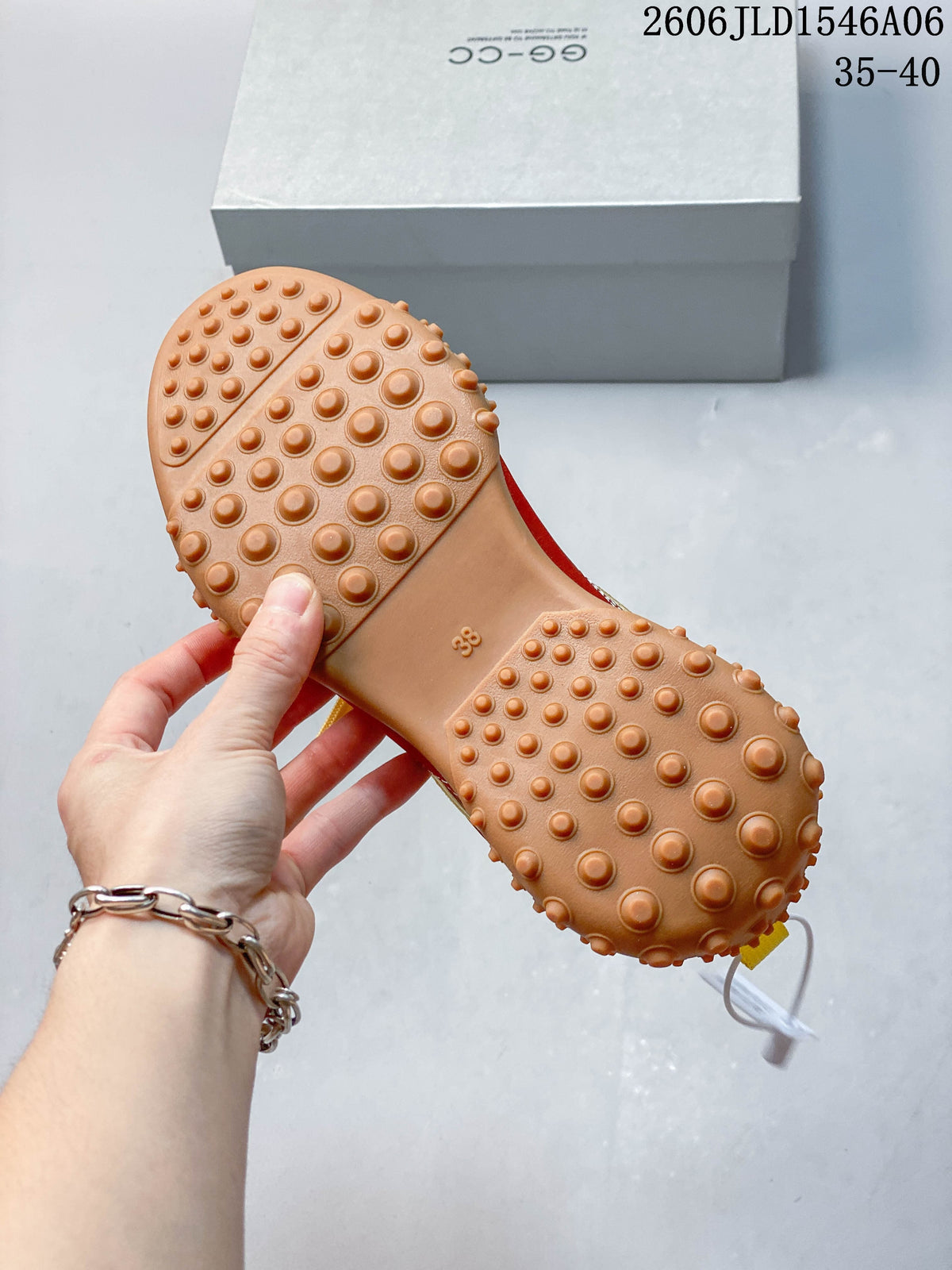 Close-up of the tan sneaker outsole with raised rounded nubs; sample marked size 38