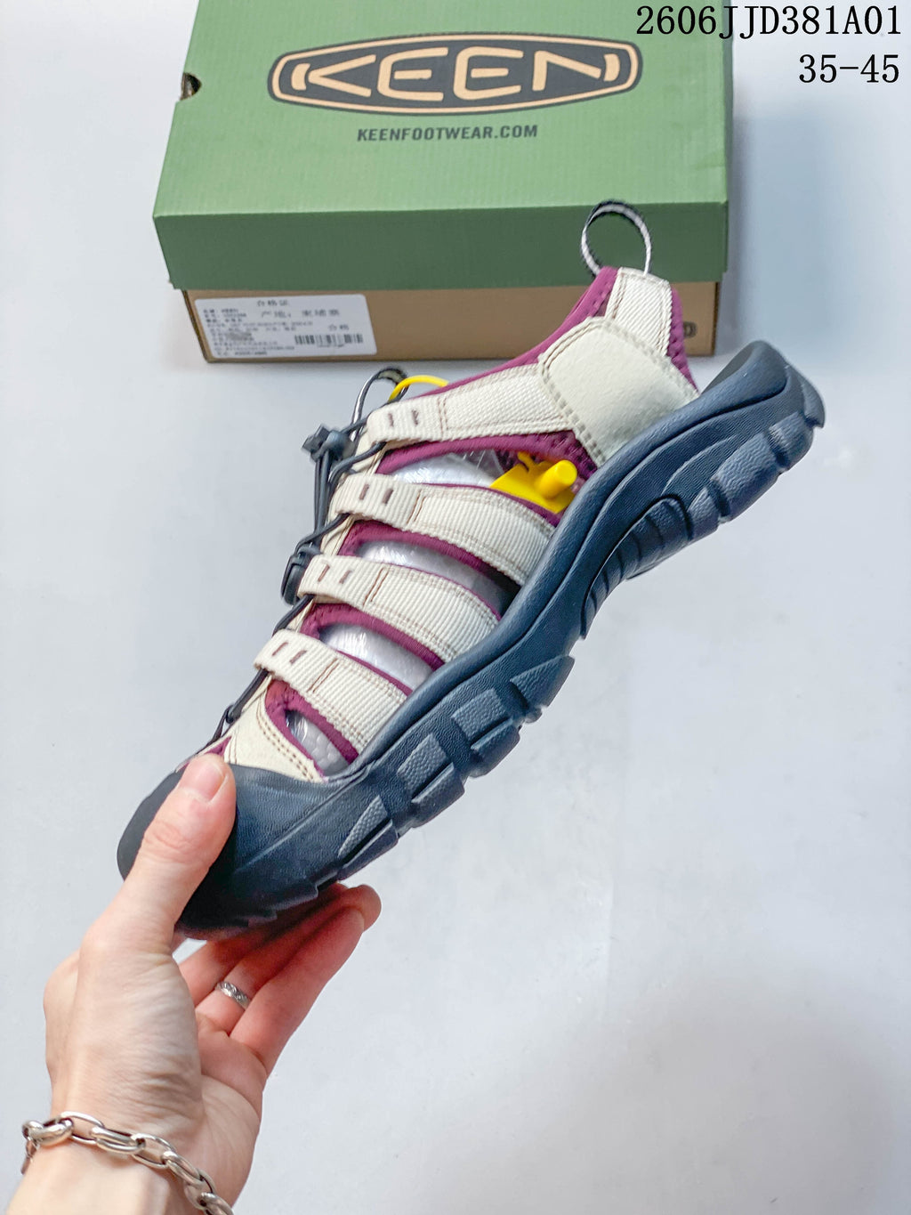 Side view of a beige and plum KEEN Newport H2 sandal with dark gray sole.