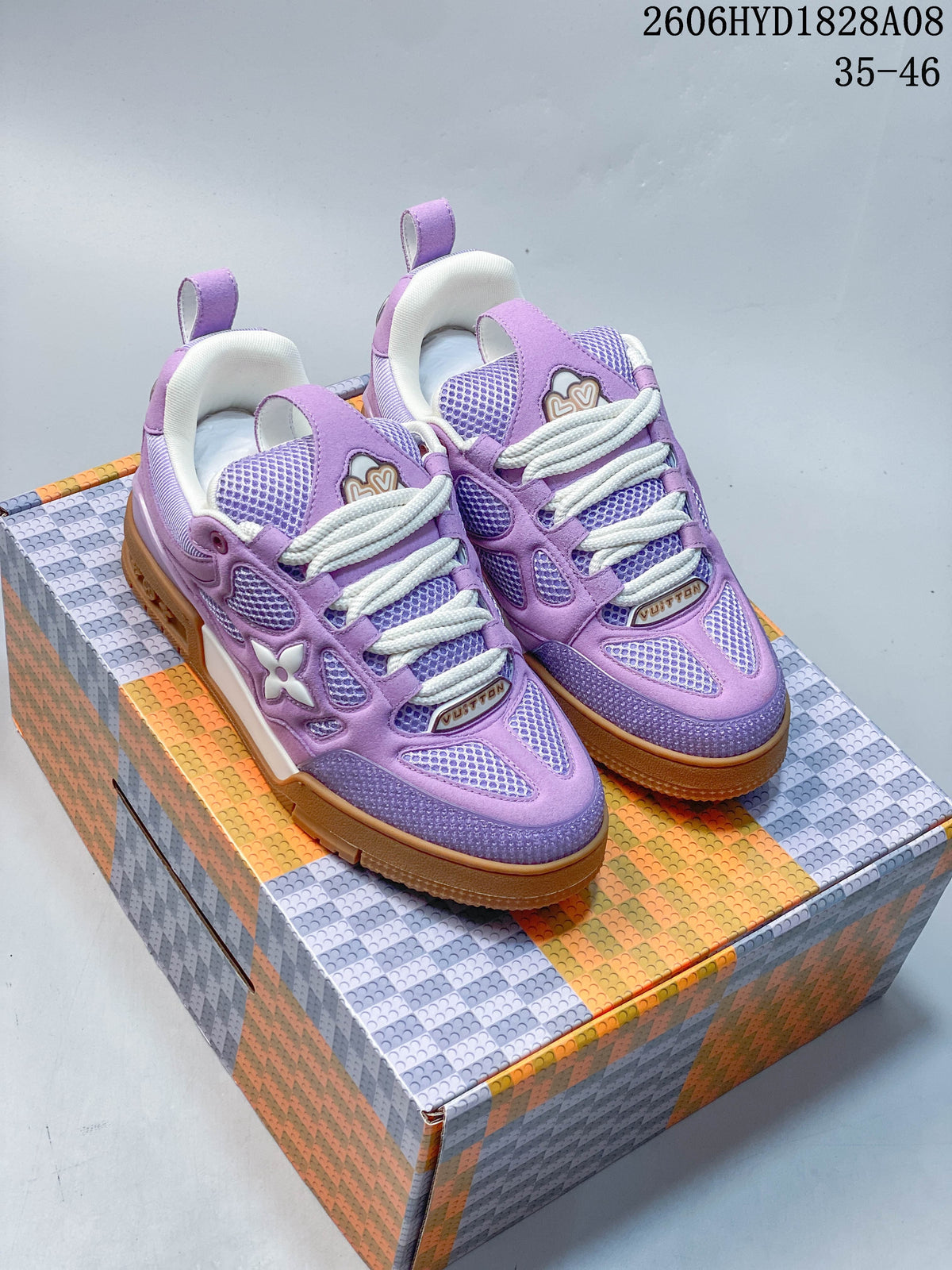 Pair of purple low-top sneakers with mesh panels, thick laces, and gum-style outsoles.
