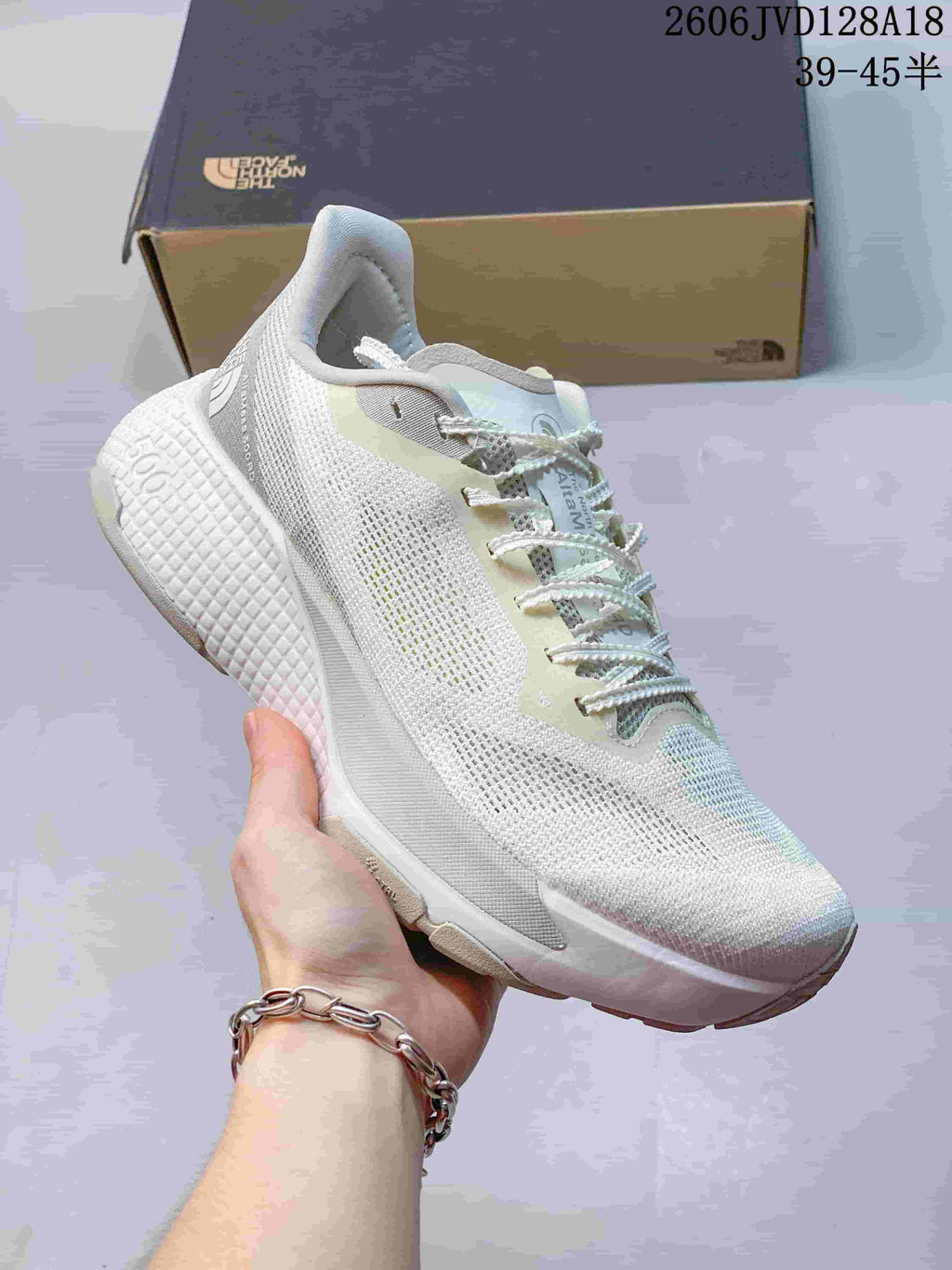 Side view of a white Alta Mesa 500 running shoe with pale neutral details and a textured sole.