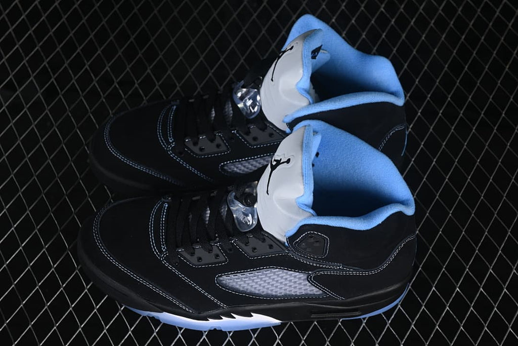 Pair of black and blue high-top sneakers shown together.