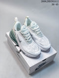 Pair of white Nike Air Max 270 sneakers with teal-toned heel units on a shoe box.
