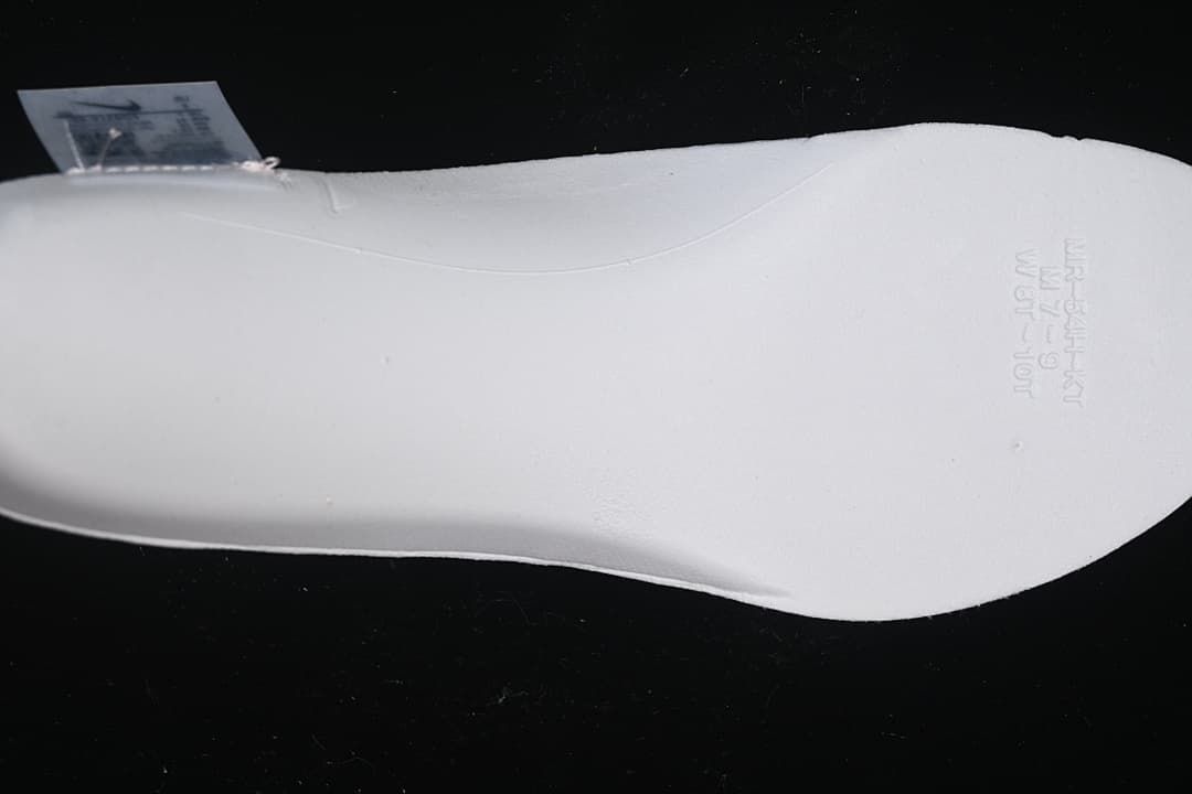 White shoe insert shown against a dark background
