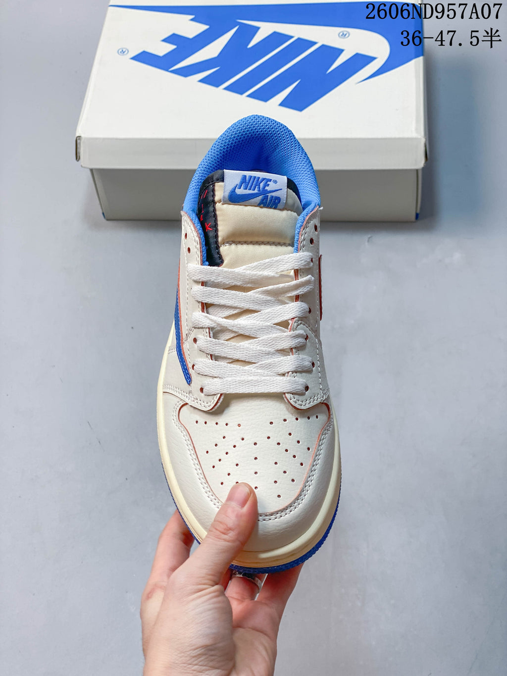 Top view showing laces, perforated toe panel, and blue collar