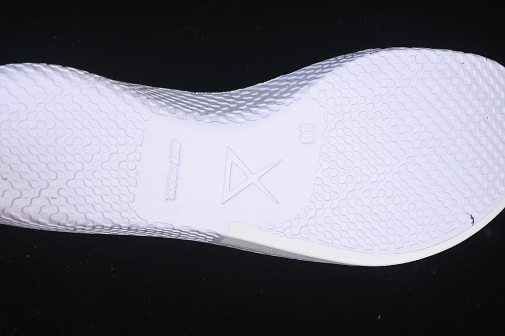 Close-up of the light-colored insole with Kobe branding