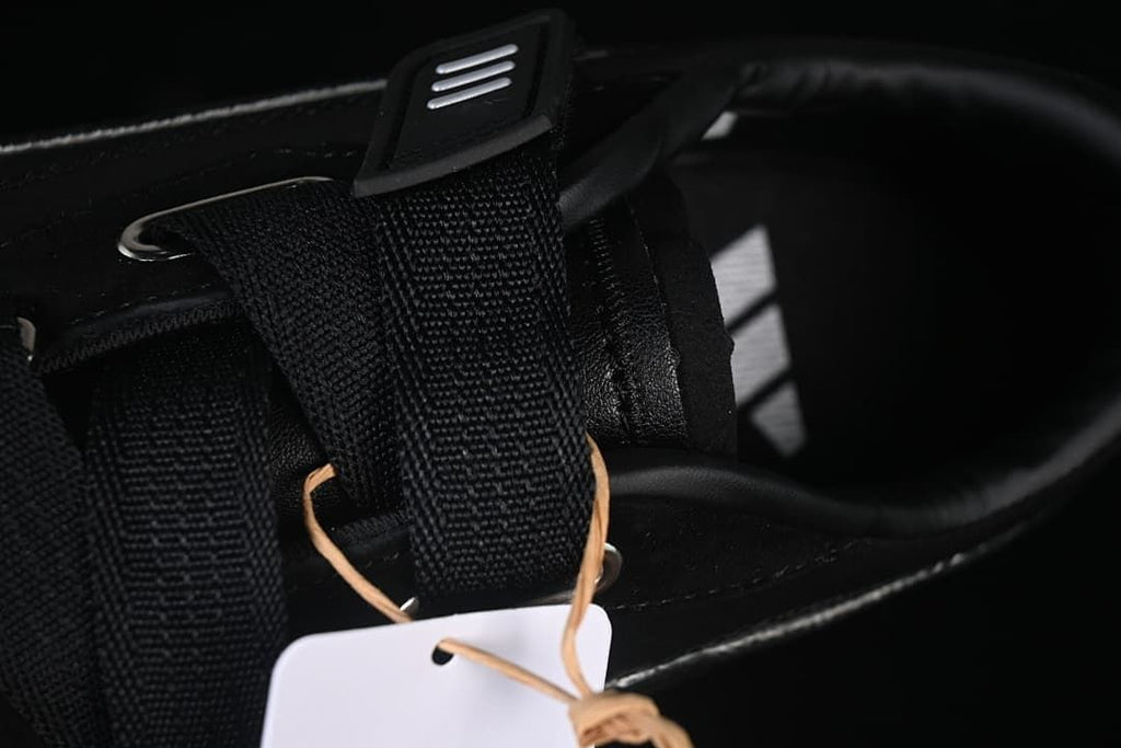 Close-up of the wide hook-and-loop strap and metal hardware