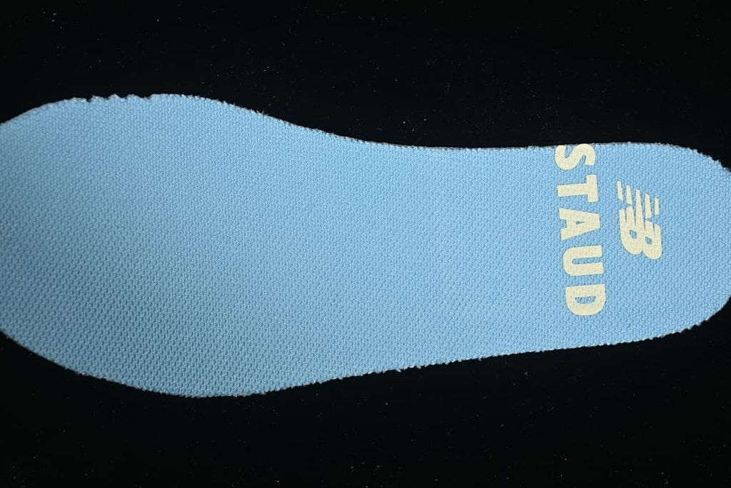 Light blue insole with New Balance branding.