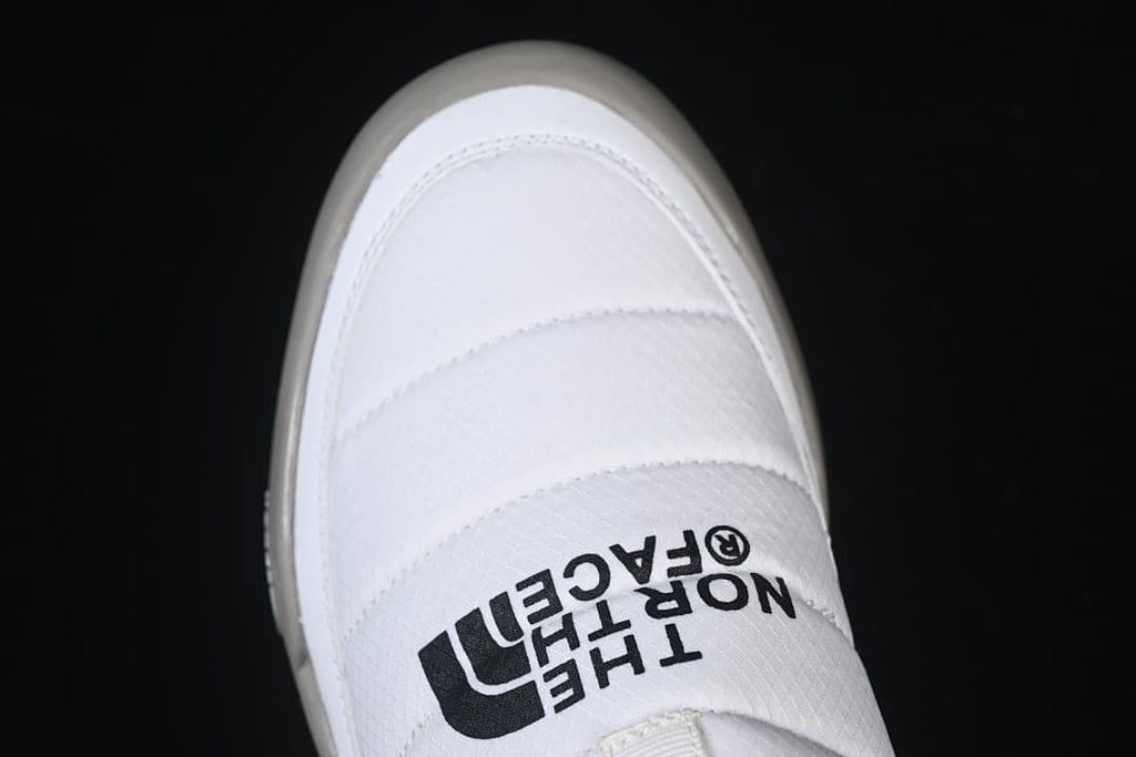Top view showing the white padded upper and The North Face logo