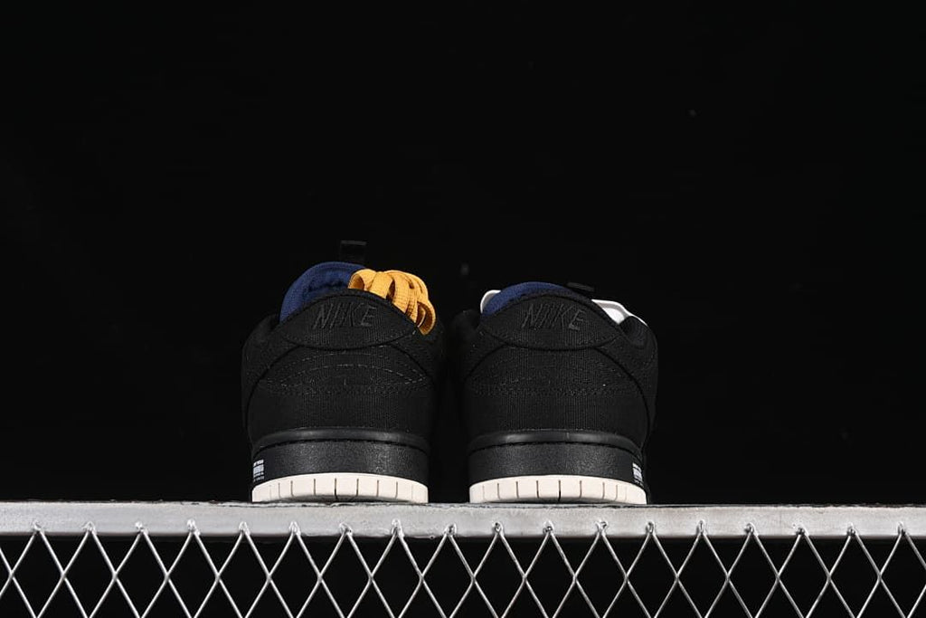 Rear view of both sneakers showing black heel panels and light-colored outsoles